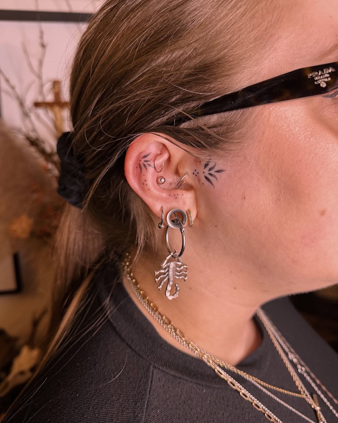 Stylish ear tattoos with scorpion and leaves Tattoo Design