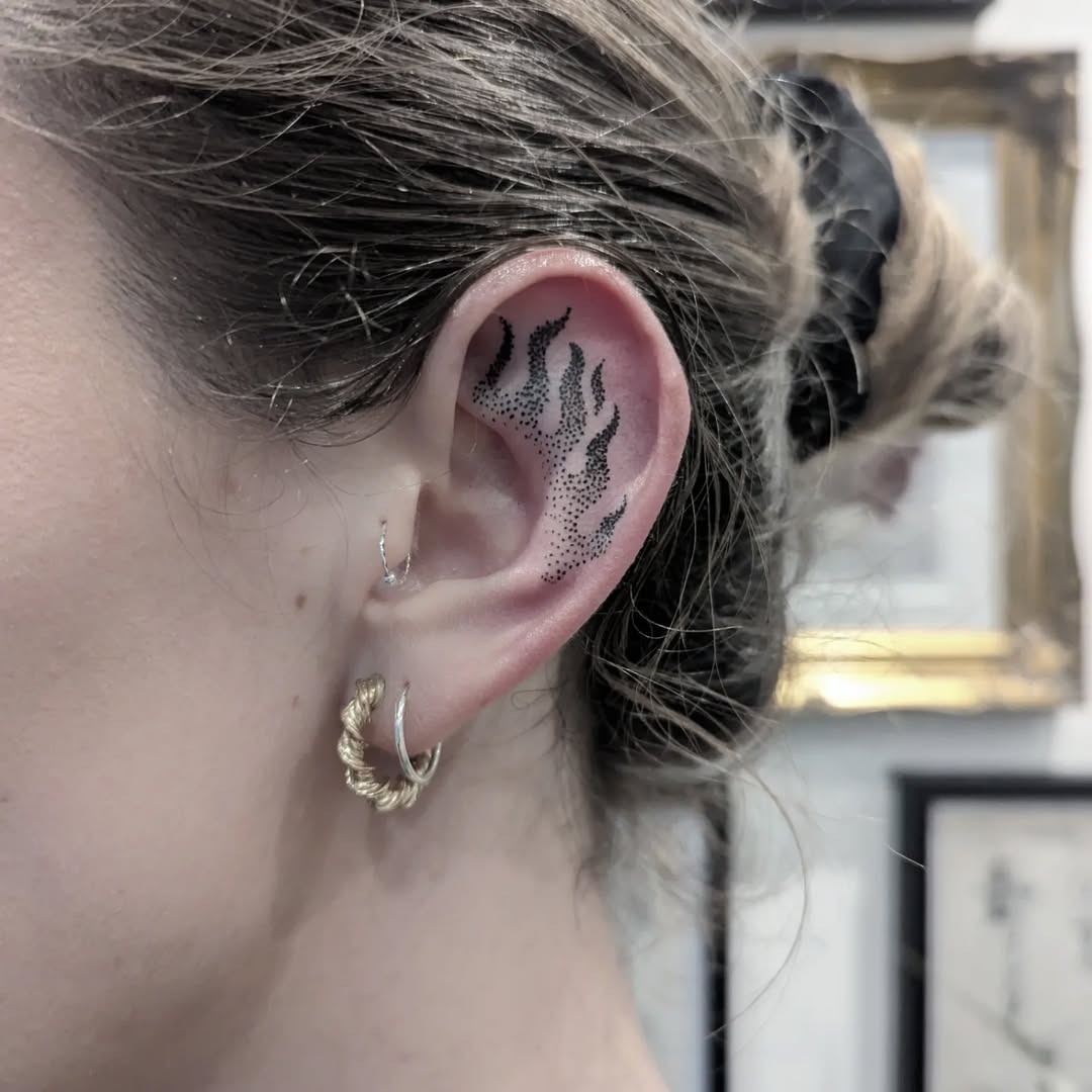 Stylish flame tattoo on the ear Tattoo Design