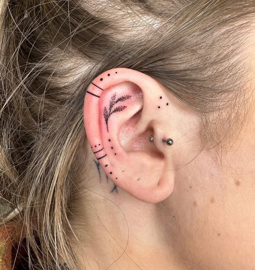 Stylish floral ear tattoo highlighting subtleness Tattoo Design