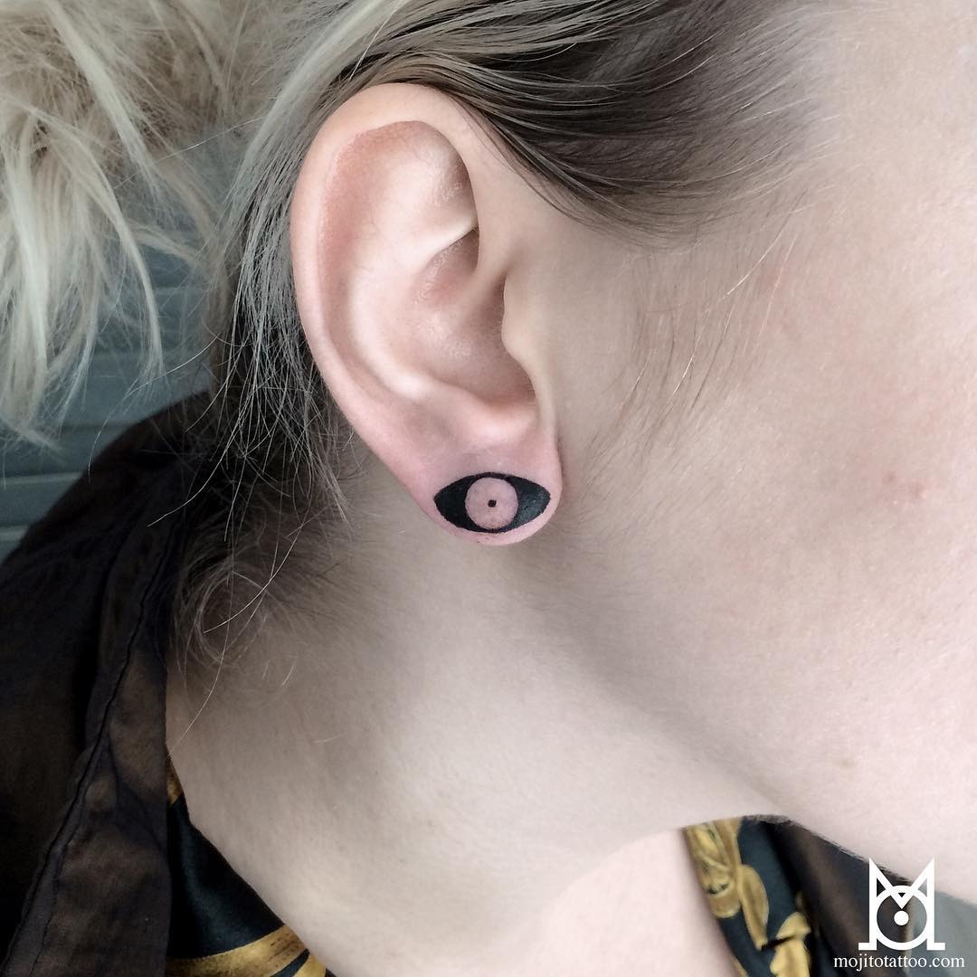Unique eye design tattoo on the ear Tattoo Design
