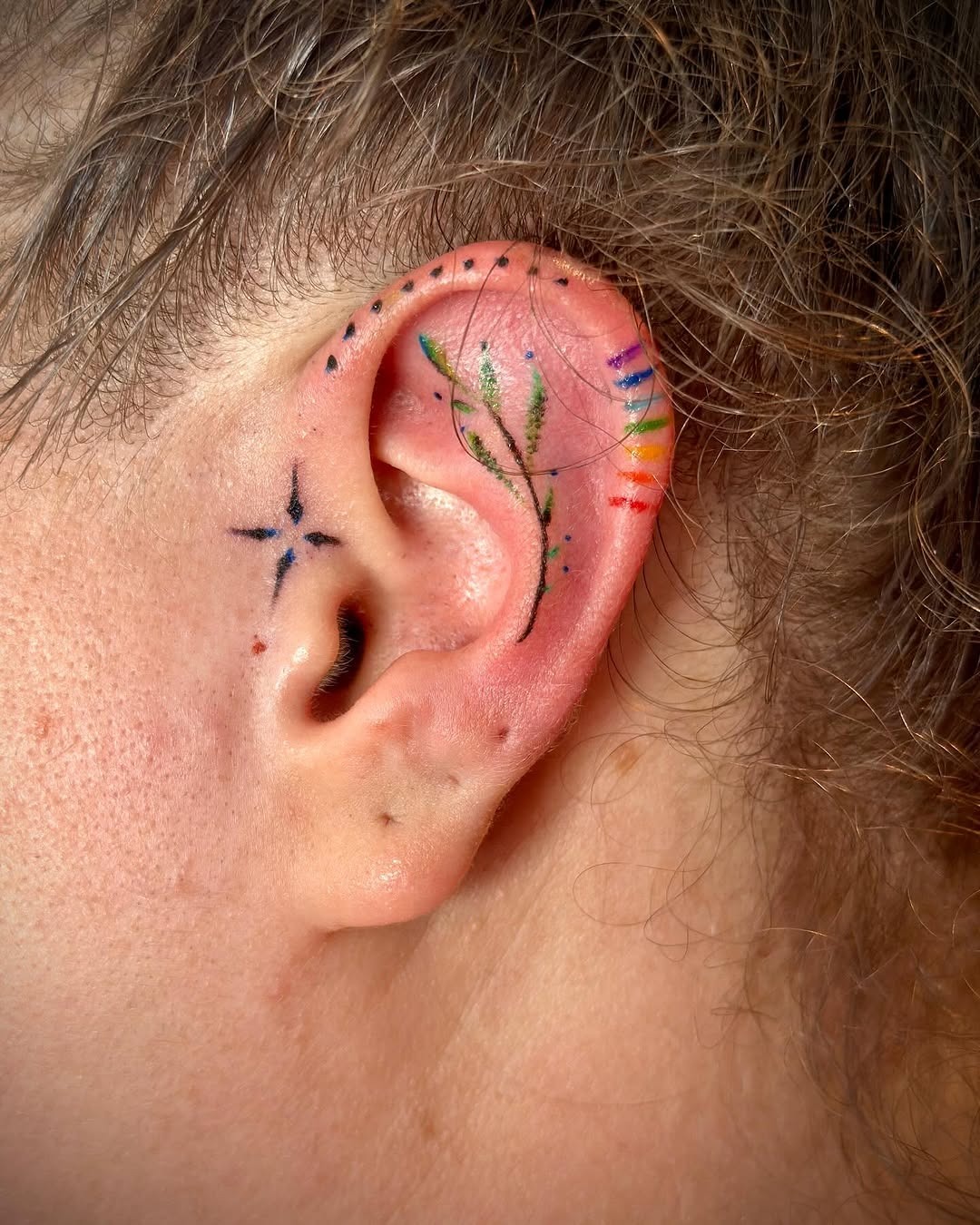 Whimsical Floral Ear Tattoo with Colors Tattoo Design