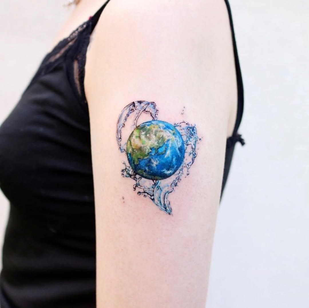A vibrant earth tattoo with floral accents Tattoo Design