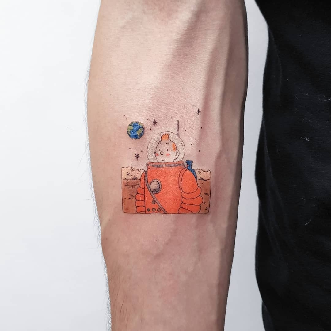 Colorful astronaut tattoo exploring Earth Tattoo Design