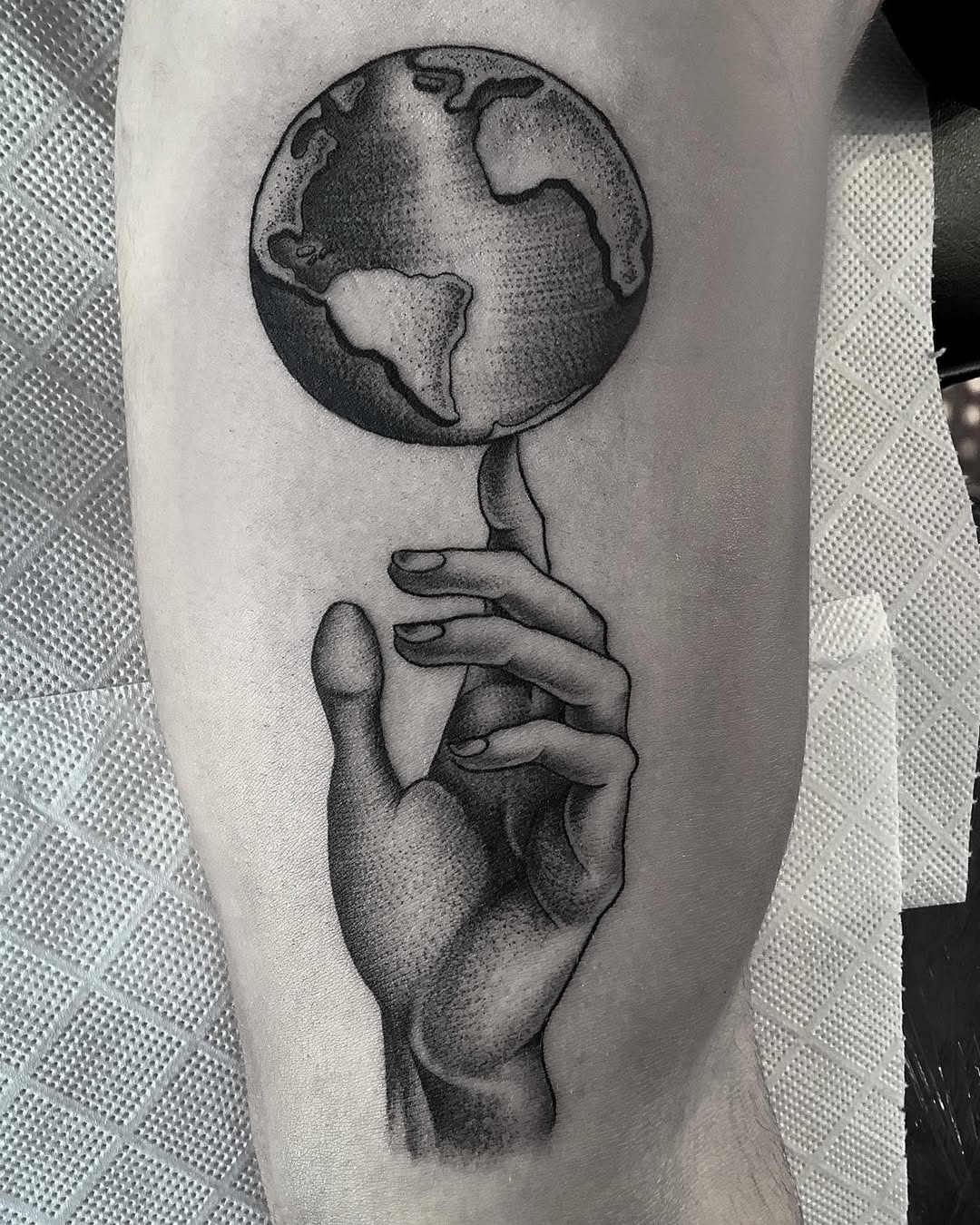 Earth and hand tattoo conveying connection Tattoo Design