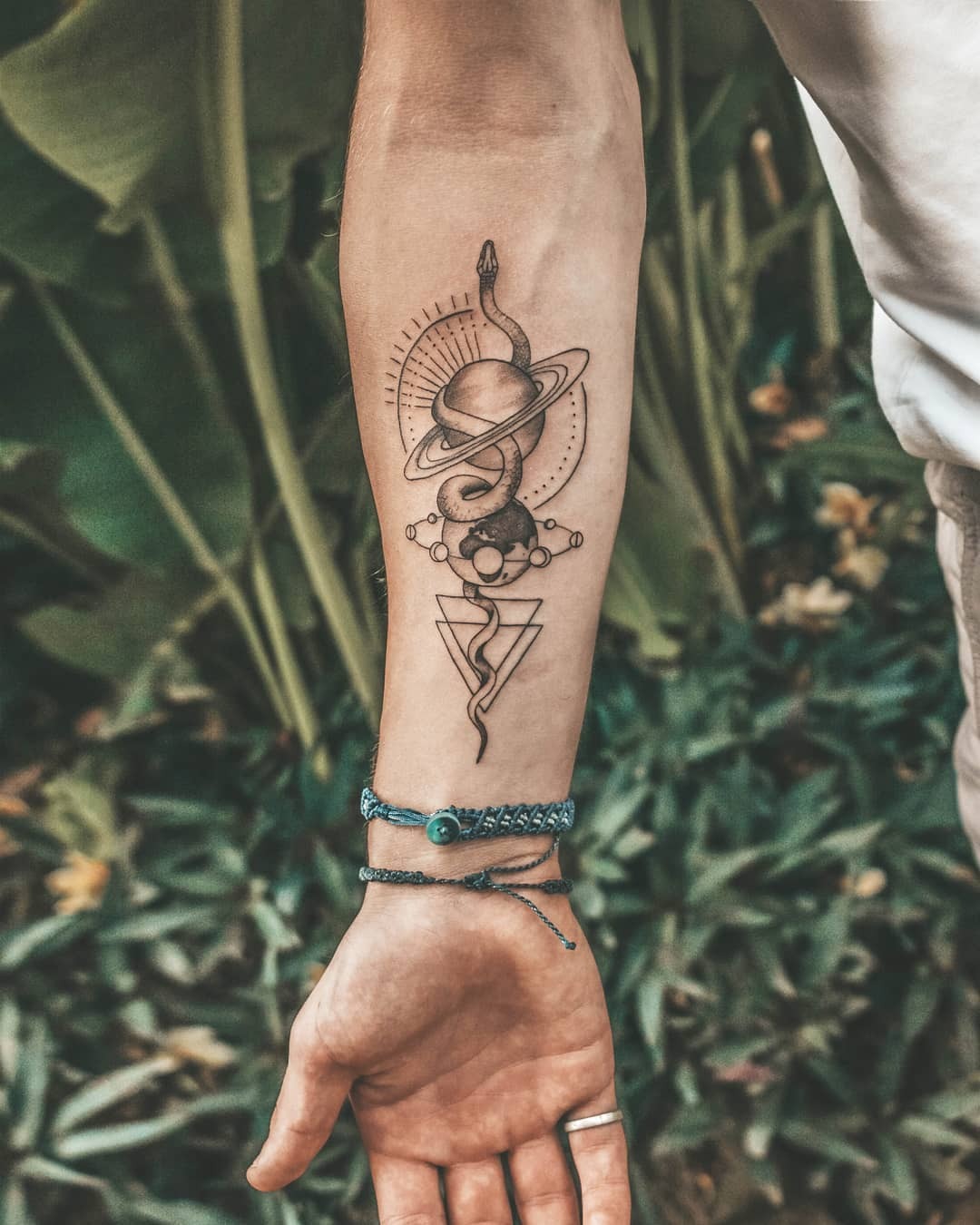 Intricate cosmic-themed earth tattoo design Tattoo Design