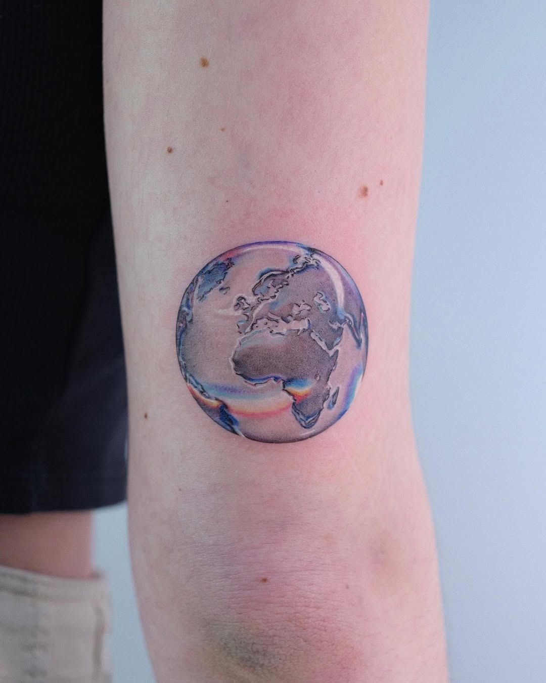 Unique Earth Tattoo Enhancing Natural Beauty Tattoo Design