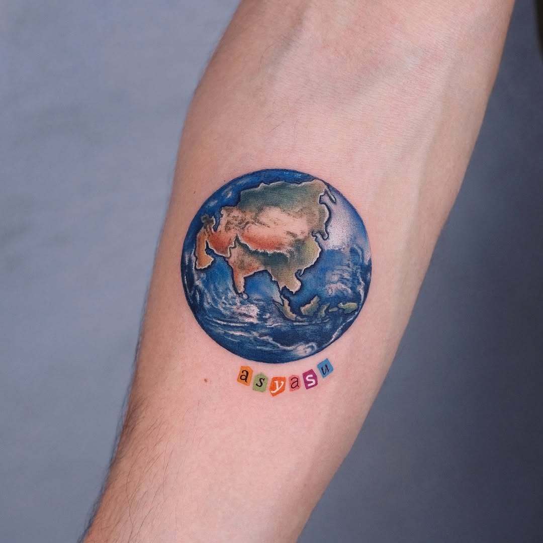 Vibrant Earth Tattoo Emphasizing Asian Continent Tattoo Design