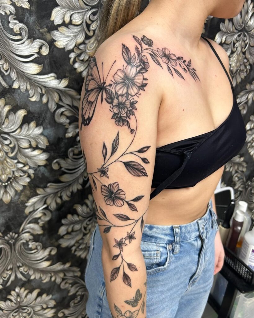 Butterfly with Flowing Floral Full Arm Tattoo Tattoo Design