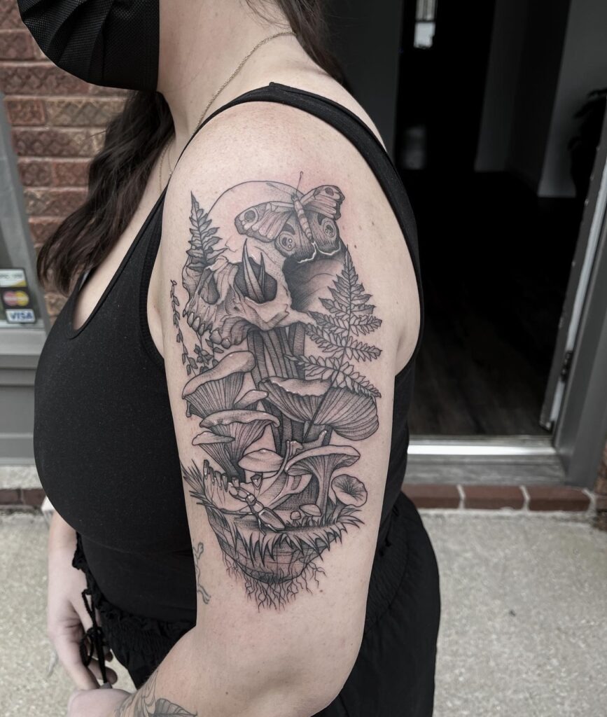 Skull with Mushrooms, Ferns, and Moth Tattoo Tattoo Design