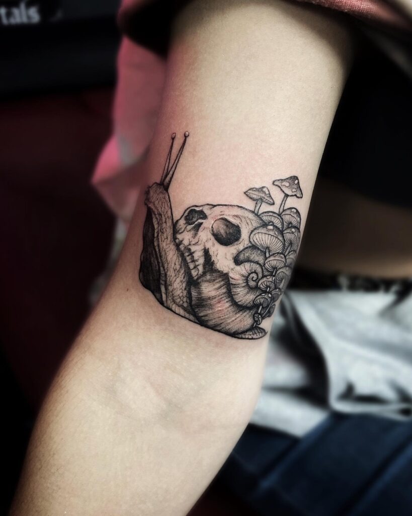 Snail Carrying Skull and Mushrooms Tattoo Tattoo Design
