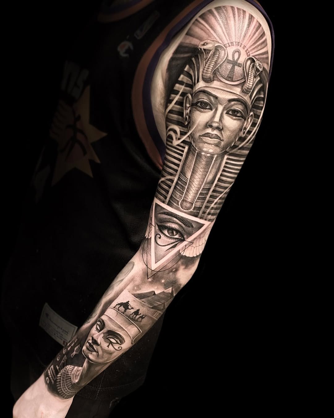 Elegant Egyptian symbols come to life in ink Tattoo Design
