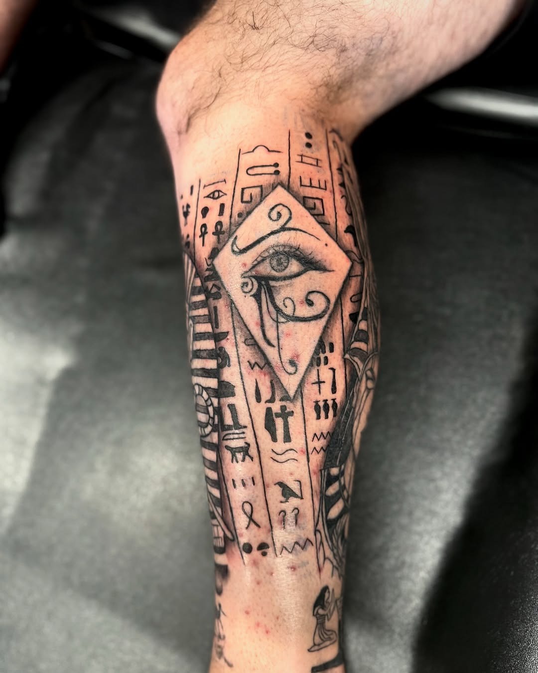 Intricate Egyptian Eye Tattoo Design on Leg Tattoo Design