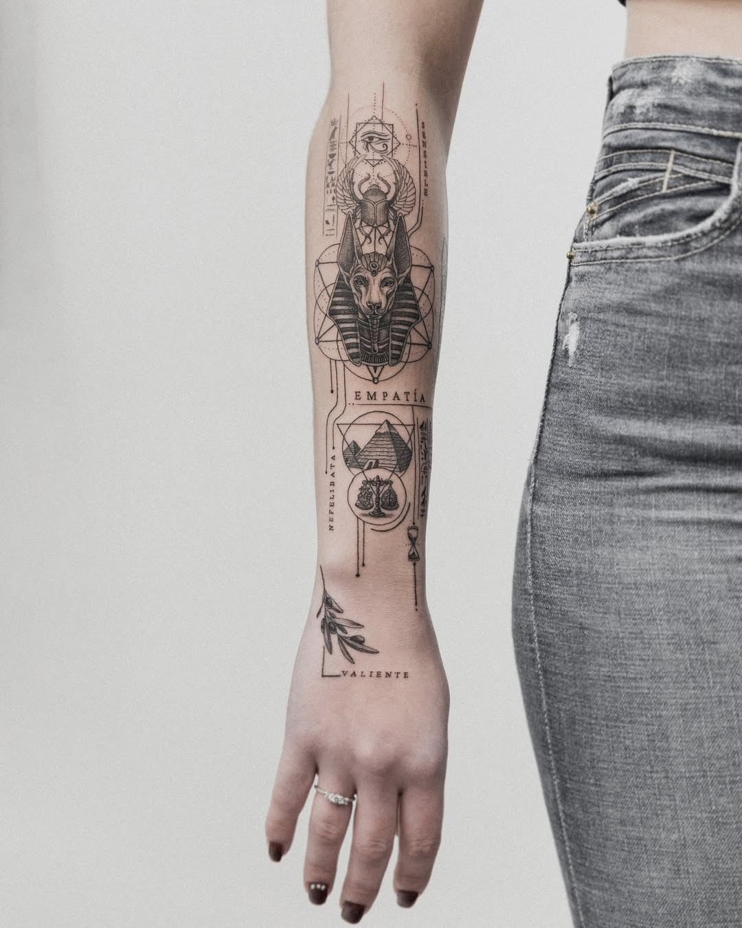 Intricate Egyptian-inspired tattoo on the forearm Tattoo Design
