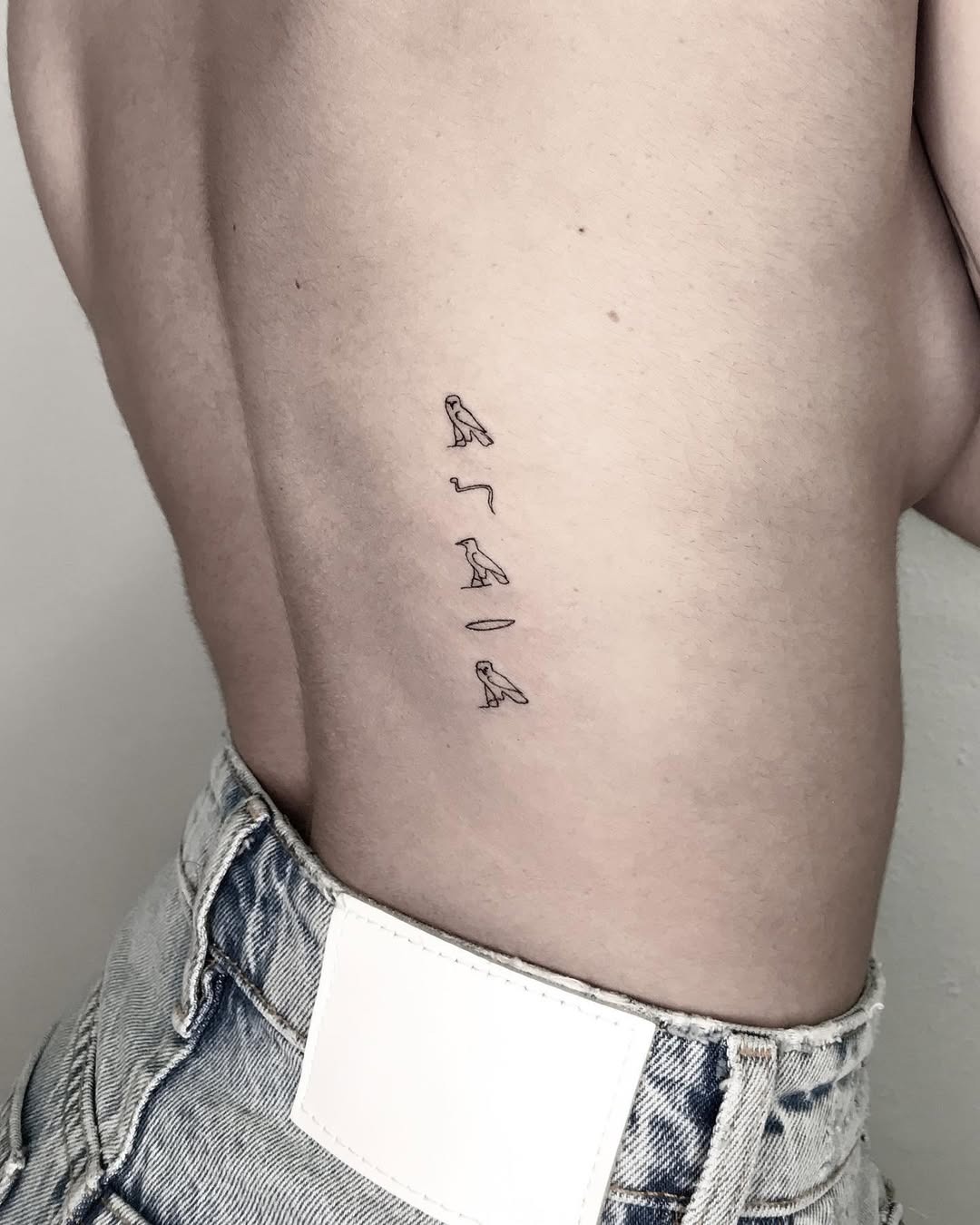 Unique minimalist Egyptian script tattoo design Tattoo Design