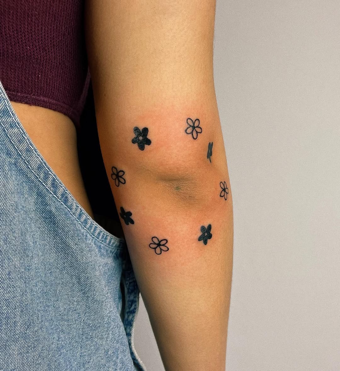 Charming flower tattoos for the elbow area Tattoo Design