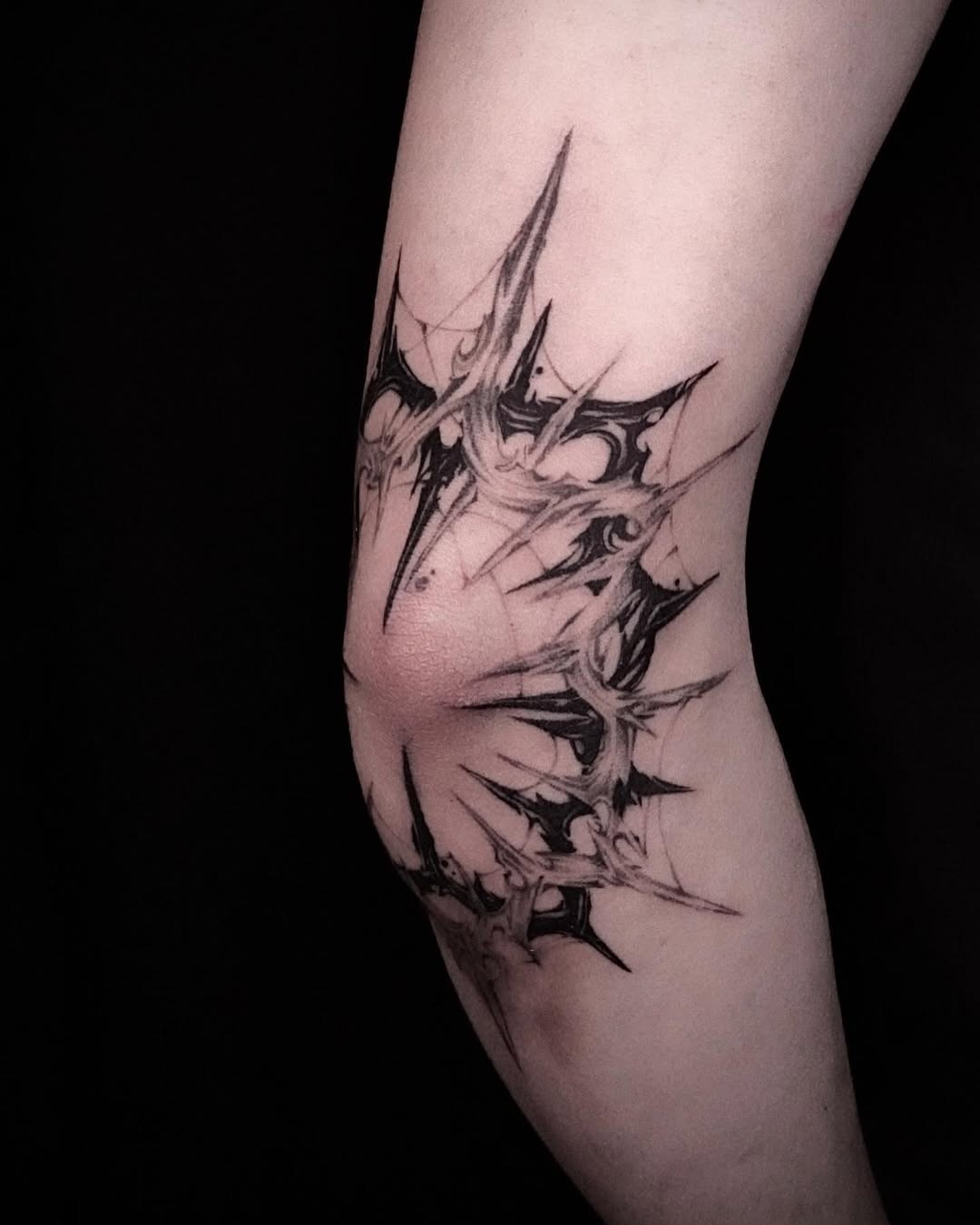 Intricate black ink elbow tattoo design Tattoo Design