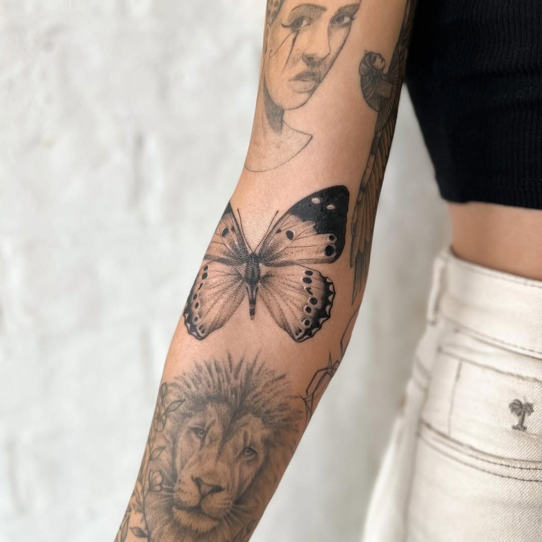 Intricate elbow tattoos with wildlife motifs Tattoo Design