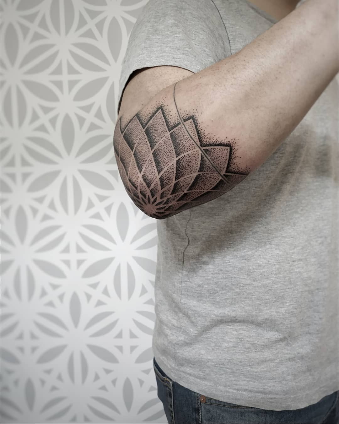 Intricate geometric elbow tattoo showcasing elegance Tattoo Design