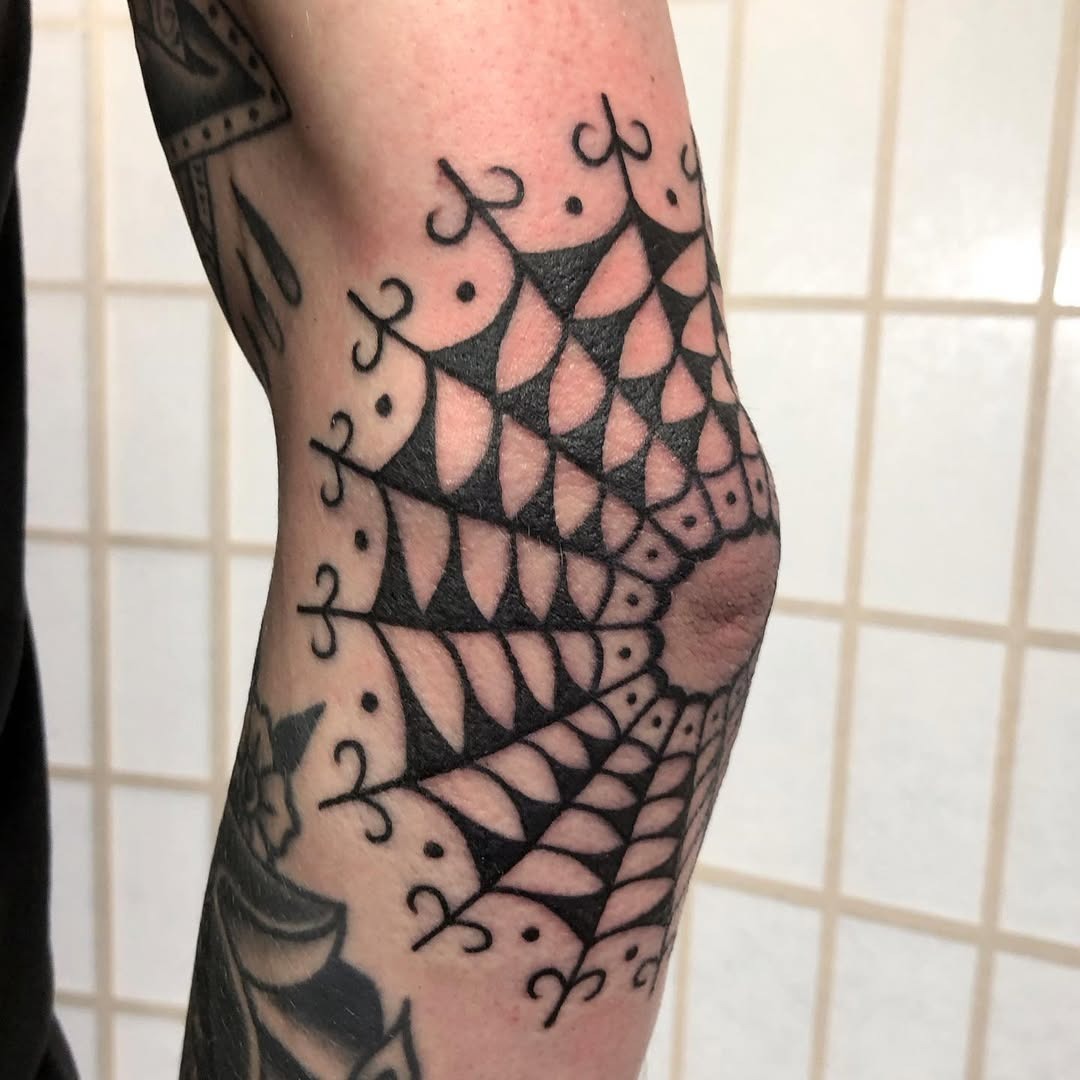 Intricate spider web design on elbow tattoo Tattoo Design