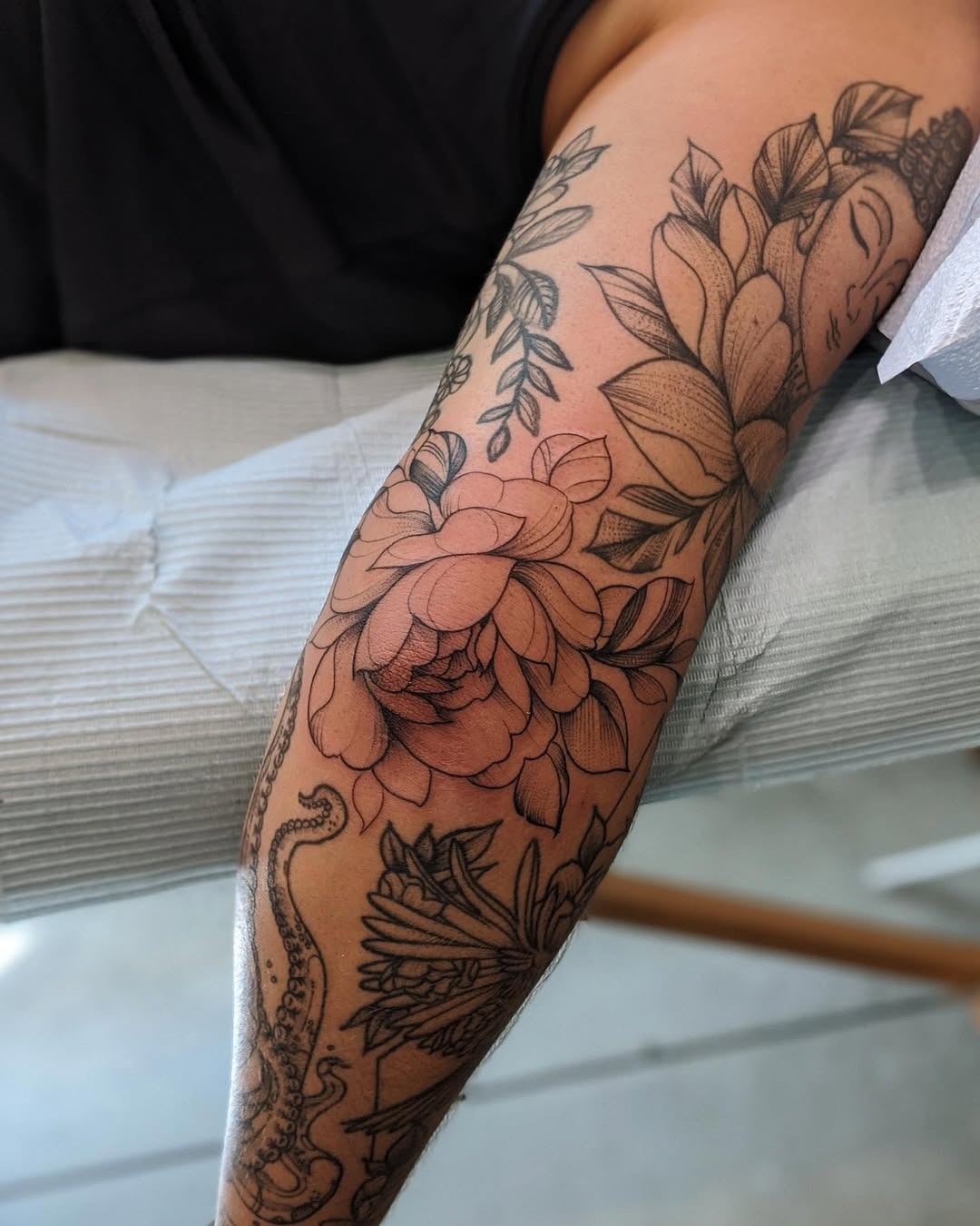 Stunning floral and octopus elbow tattoo design Tattoo Design