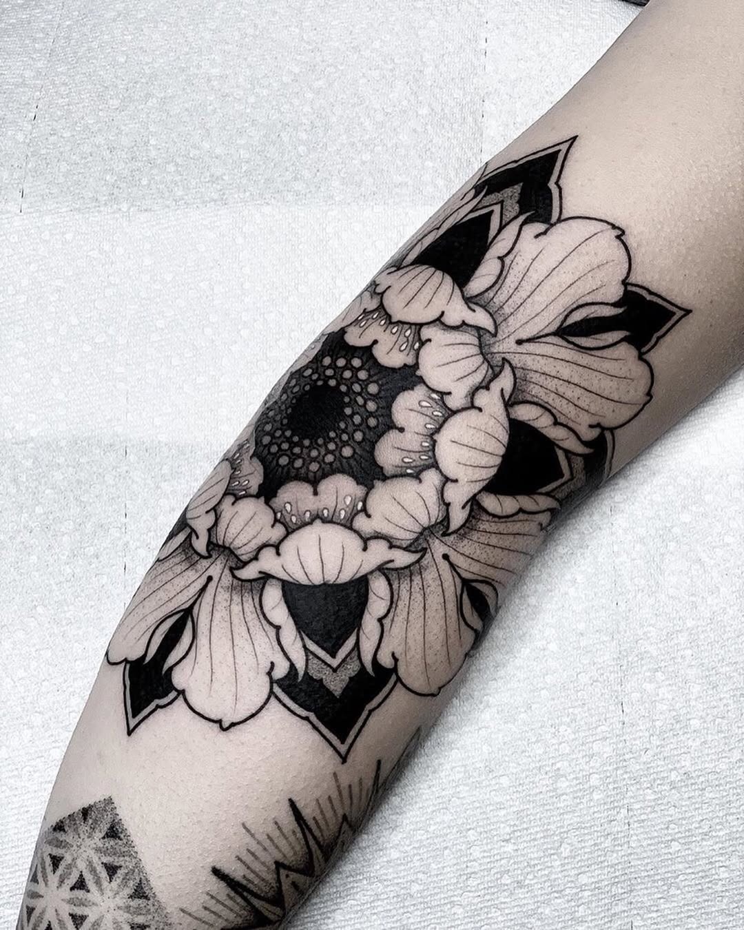 Stunning floral elbow tattoo design in blackwork Tattoo Design