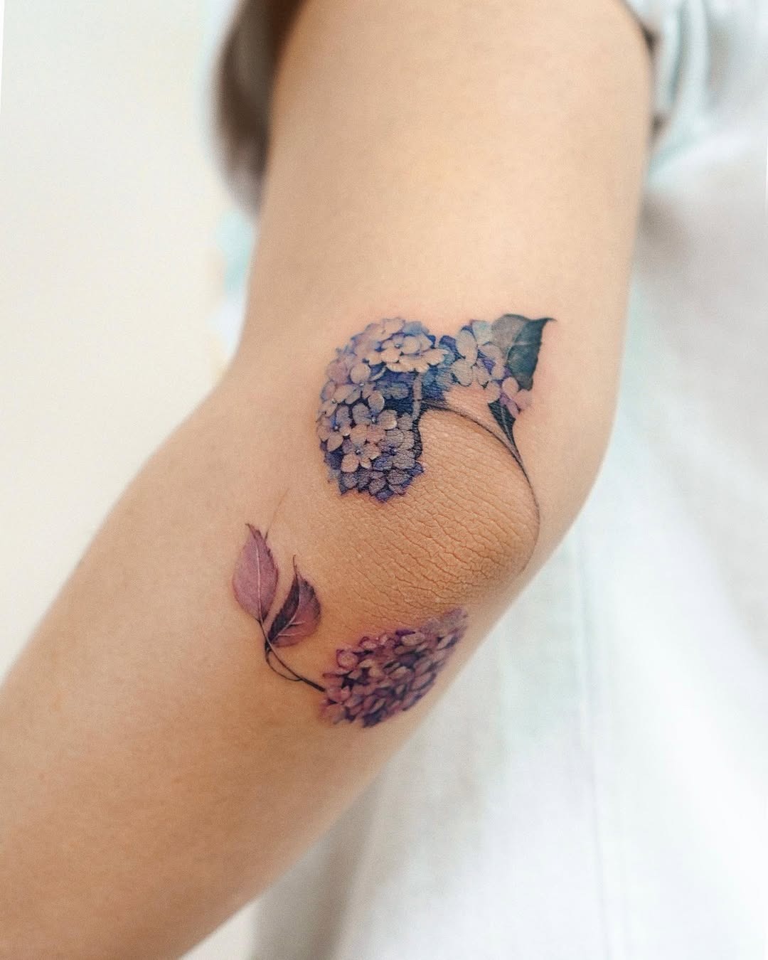 Stunning floral elbow tattoo with intricate details Tattoo Design