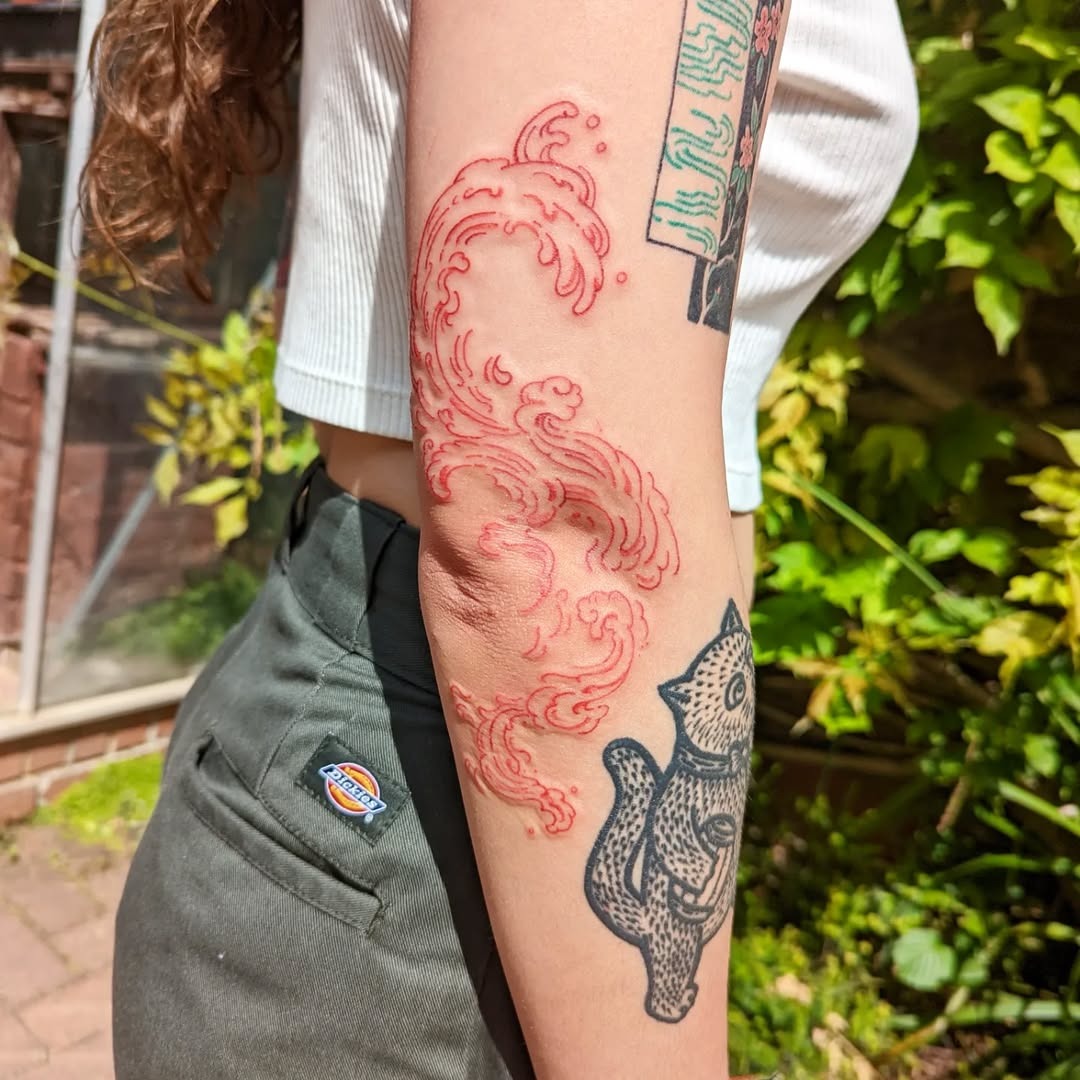 Stunning red wave design with fish tattoo Tattoo Design