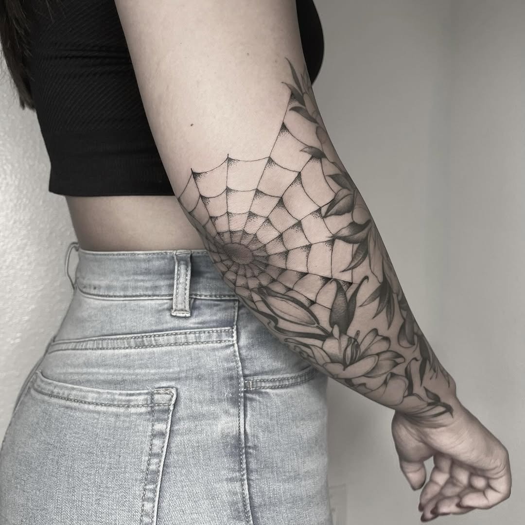 Stunning spider web and floral elbow tattoo Tattoo Design