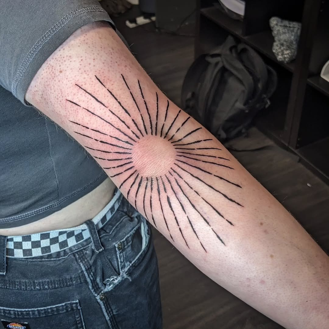 Stunning sunburst elbow tattoo design inspiration Tattoo Design