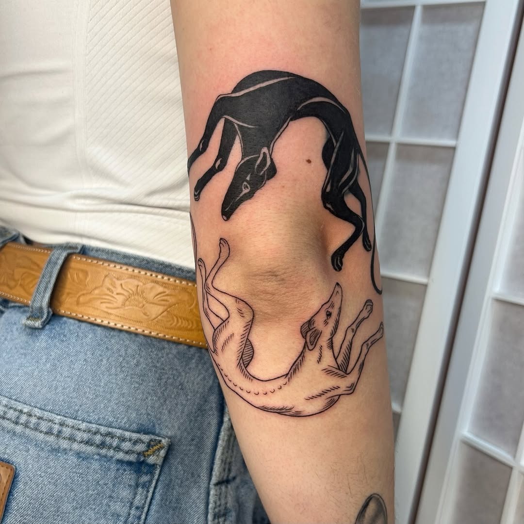 Stylish canine-themed elbow tattoo design Tattoo Design