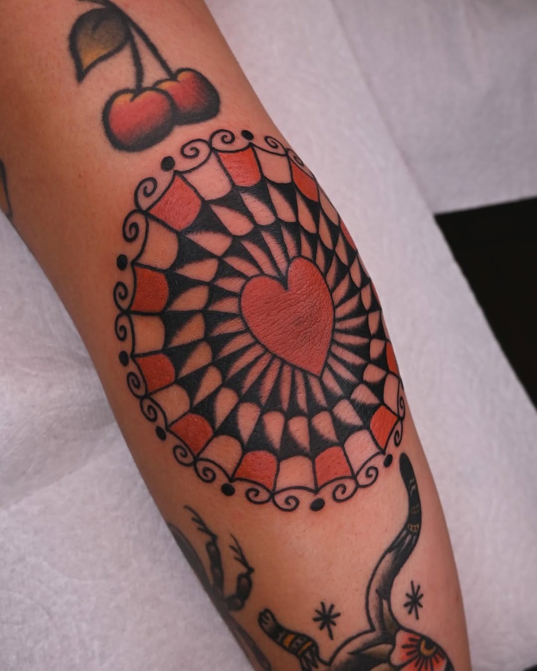 Stylish heart pattern tattoo on elbow. Tattoo Design