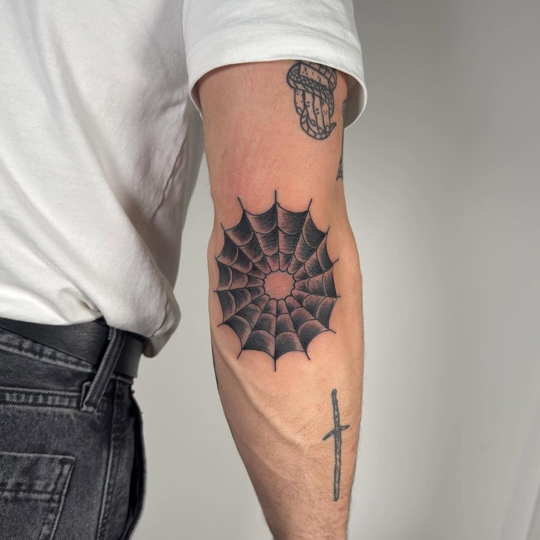 Stylish spider web tattoo on elbow Tattoo Design
