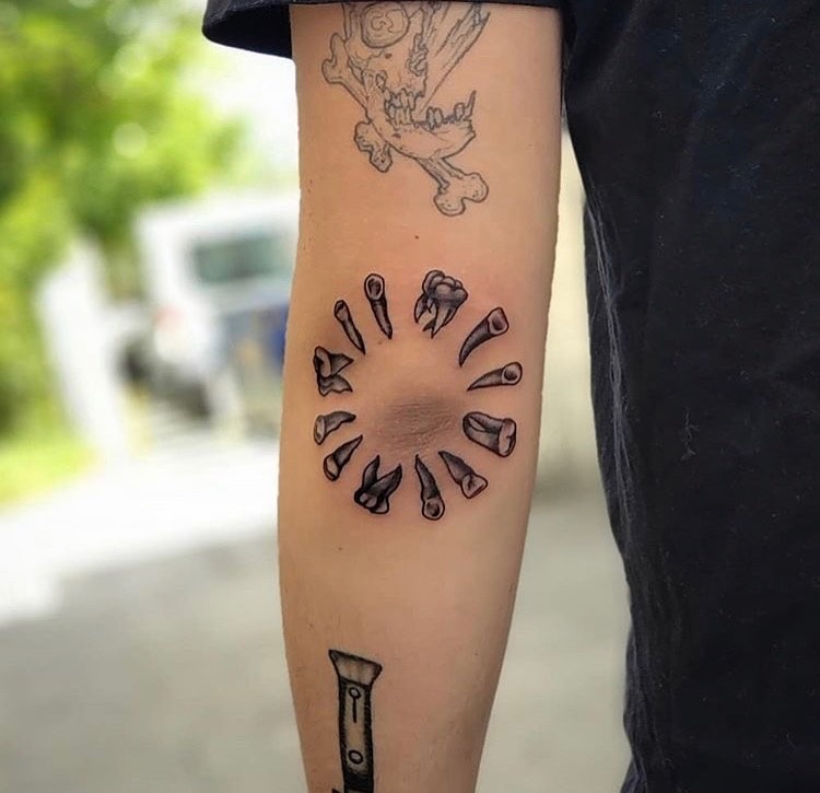 Unique artistic elbow tattoo featuring tool circle Tattoo Design