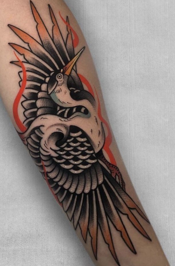 Bold American Traditional Crane Arm Tattoo Tattoo Design