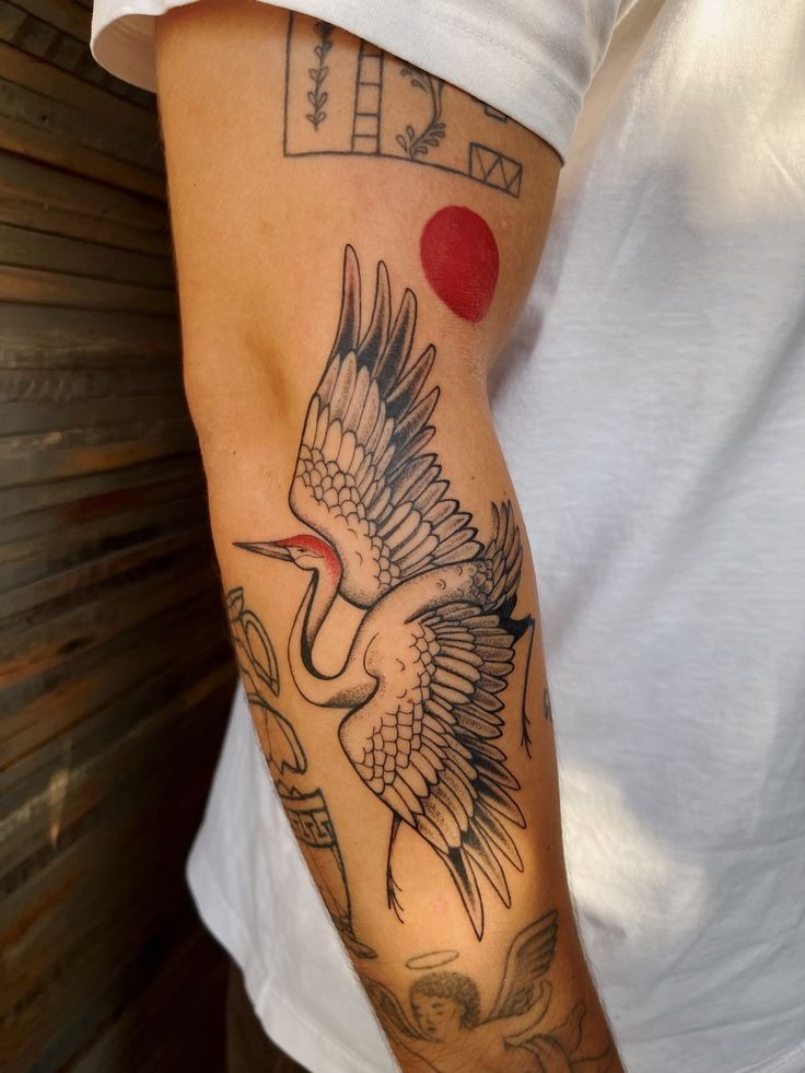 Red Sun Crane Arm Tattoo Tattoo Design