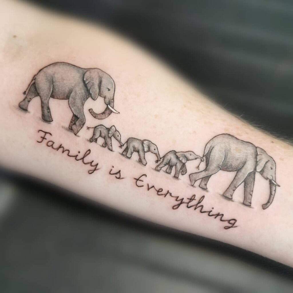 Elephant Parade with Quote Tattoo Tattoo Design