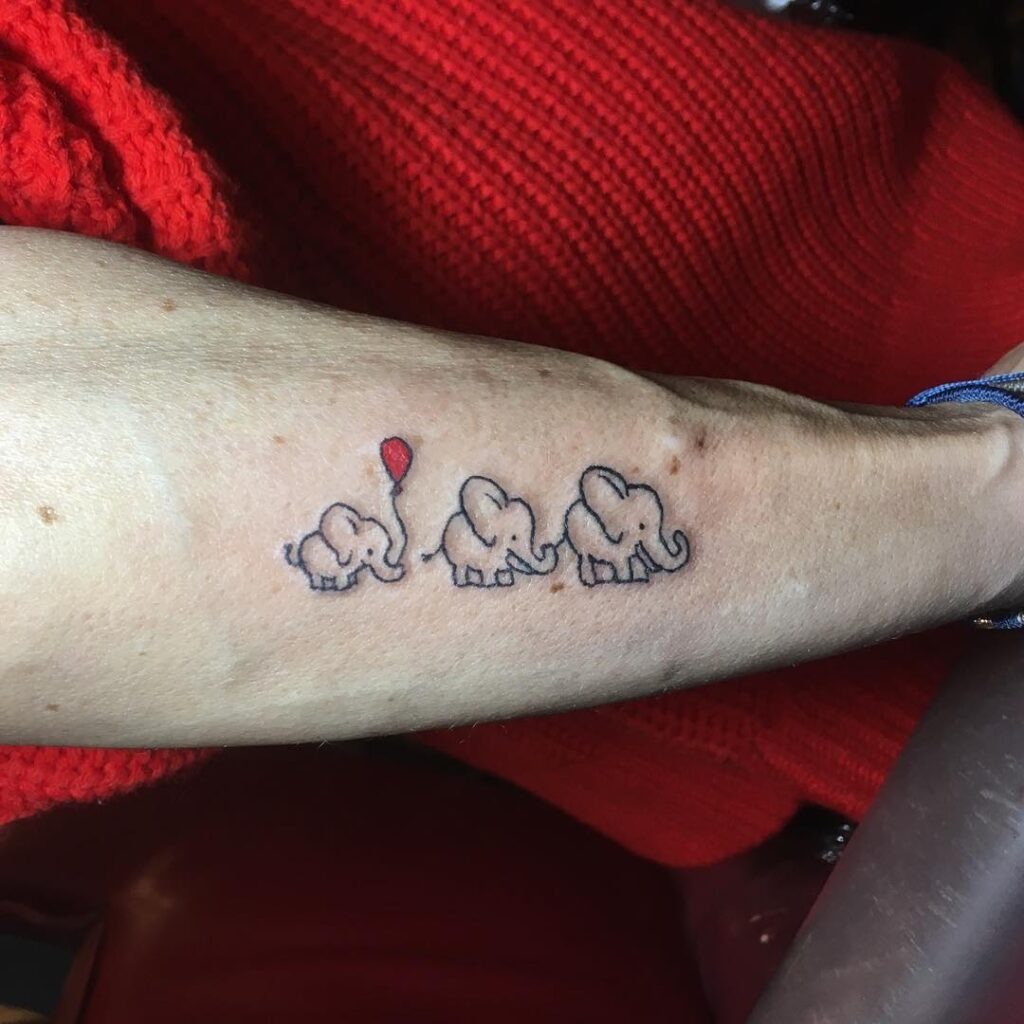 Playful Elephant Trio with Balloon Tattoo Tattoo Design