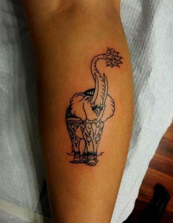 A beautifully decorated elephant tattoo on the leg Tattoo Design
