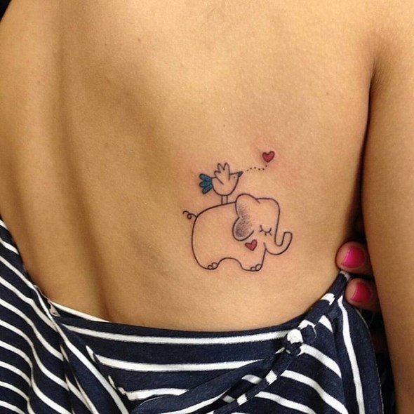 Lovely elephant tattoos on a lady’s back Tattoo Design