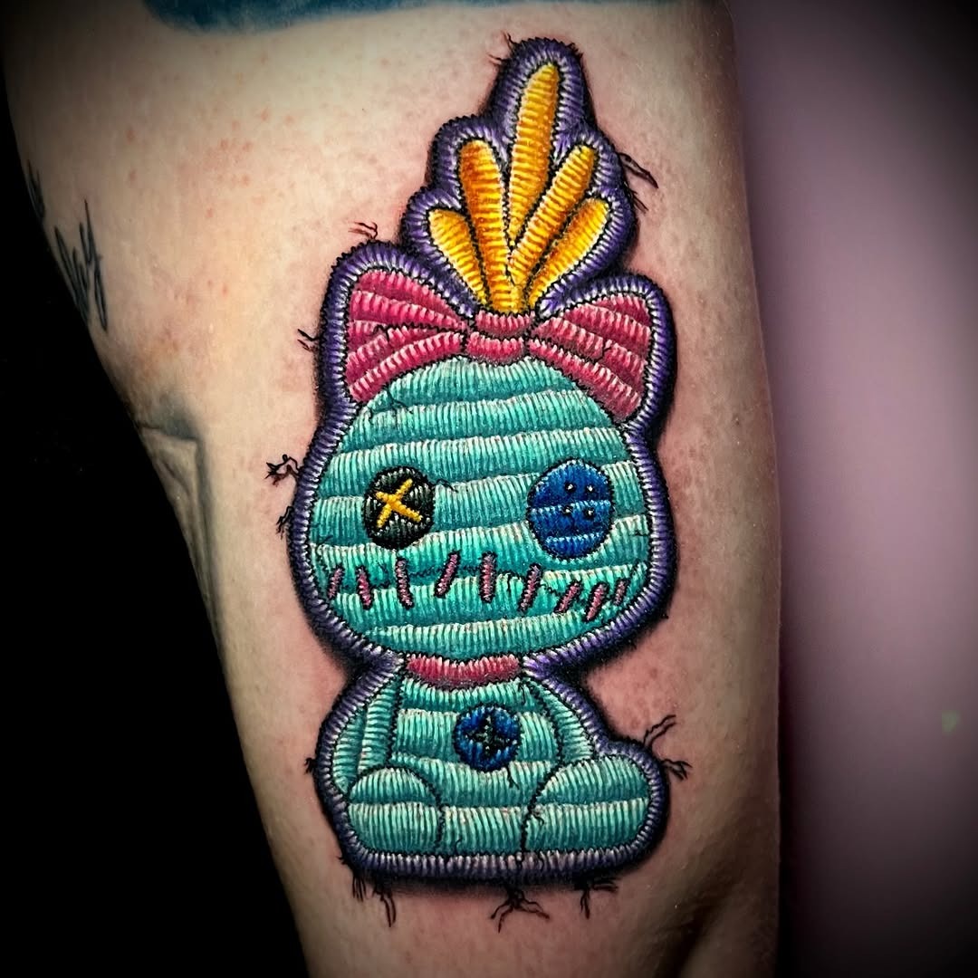 Charming vintage-inspired stitched character tattoo Tattoo Design