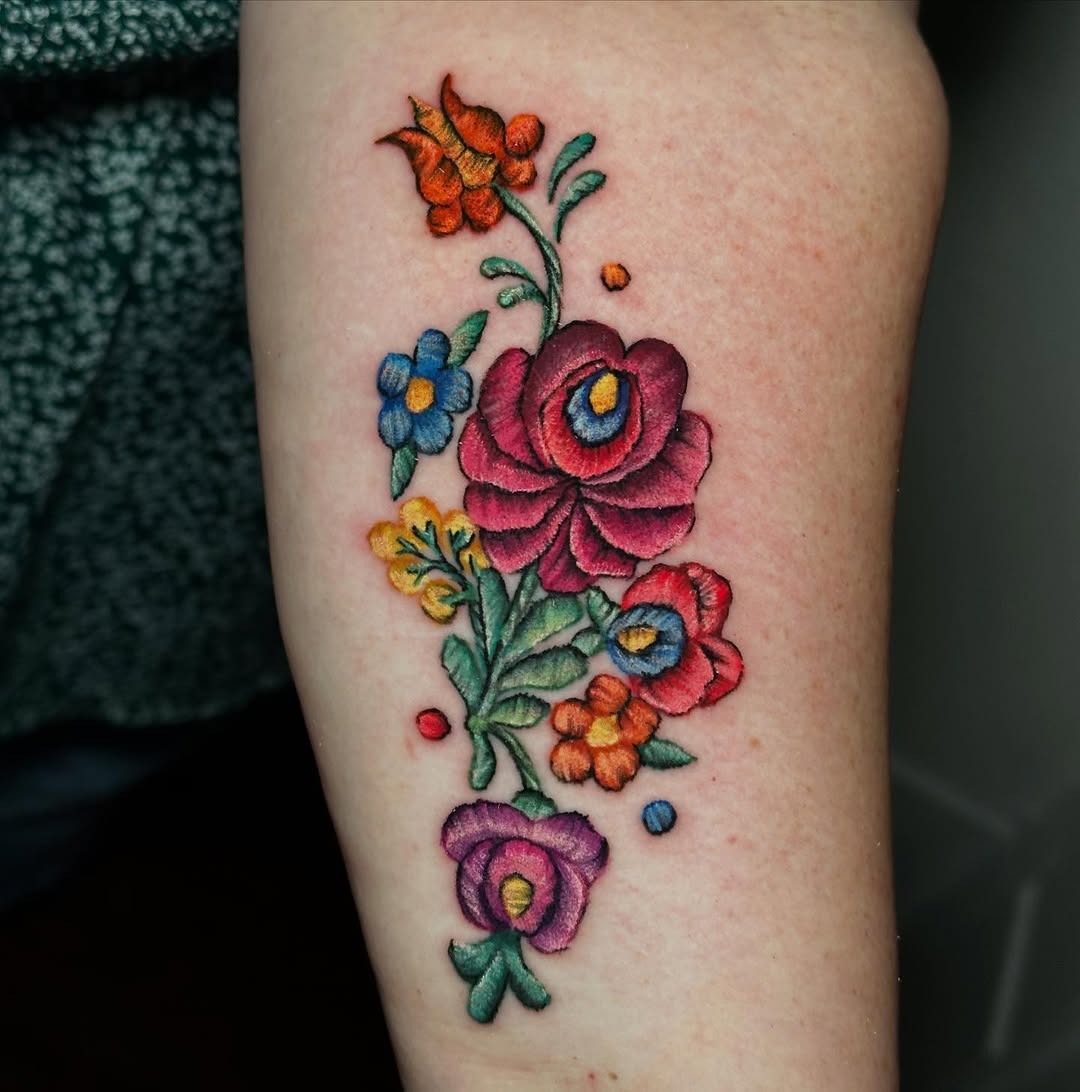 Elegant floral embroidery-style tattoo design Tattoo Design