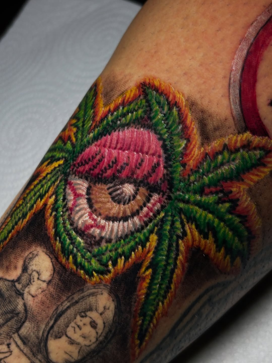 Unique embroidery-style eye and leaf tattoo Tattoo Design