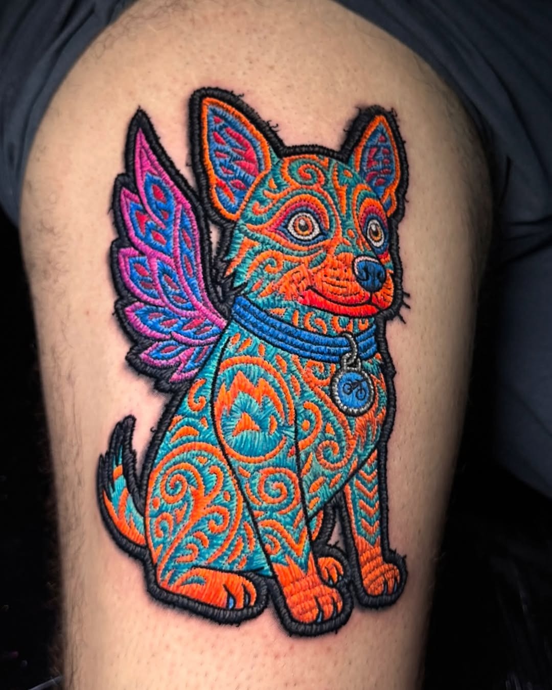 Vibrant embroidered canine with magical wings. Tattoo Design