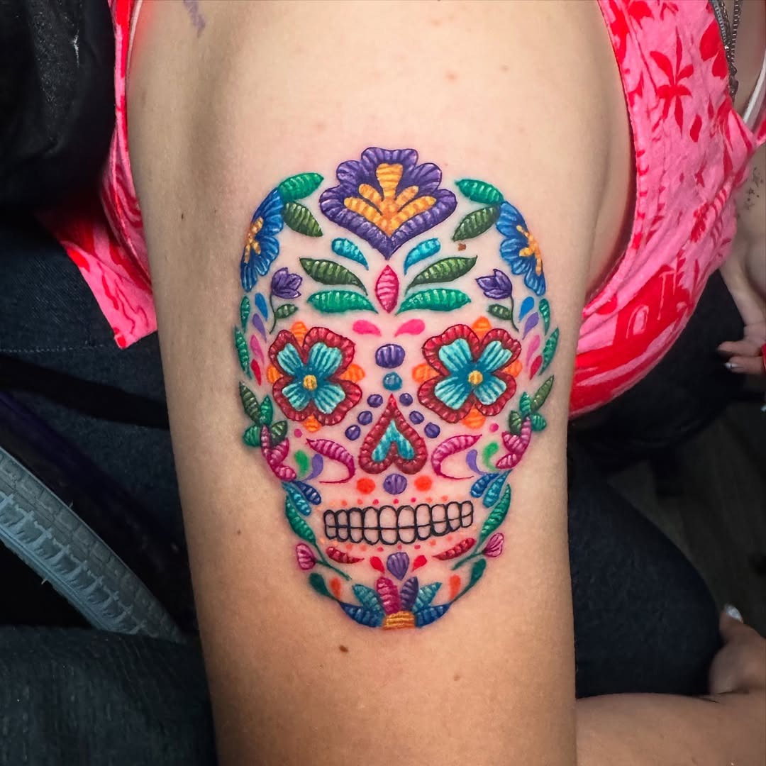 Vibrant sugar skull tattoo with floral embroidery Tattoo Design