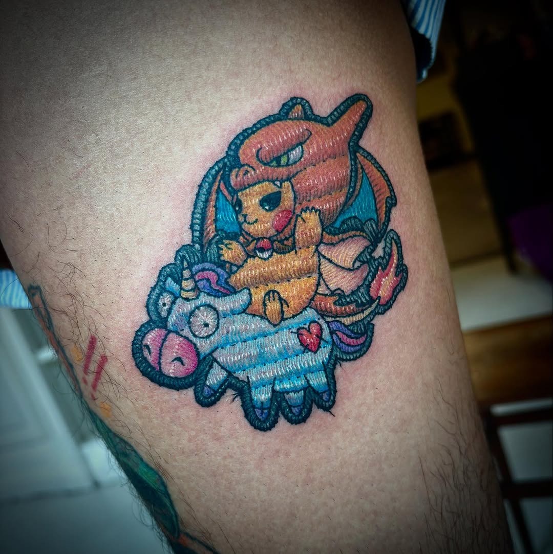 Whimsical Characters Embroidered with Vibrant Threads Tattoo Design