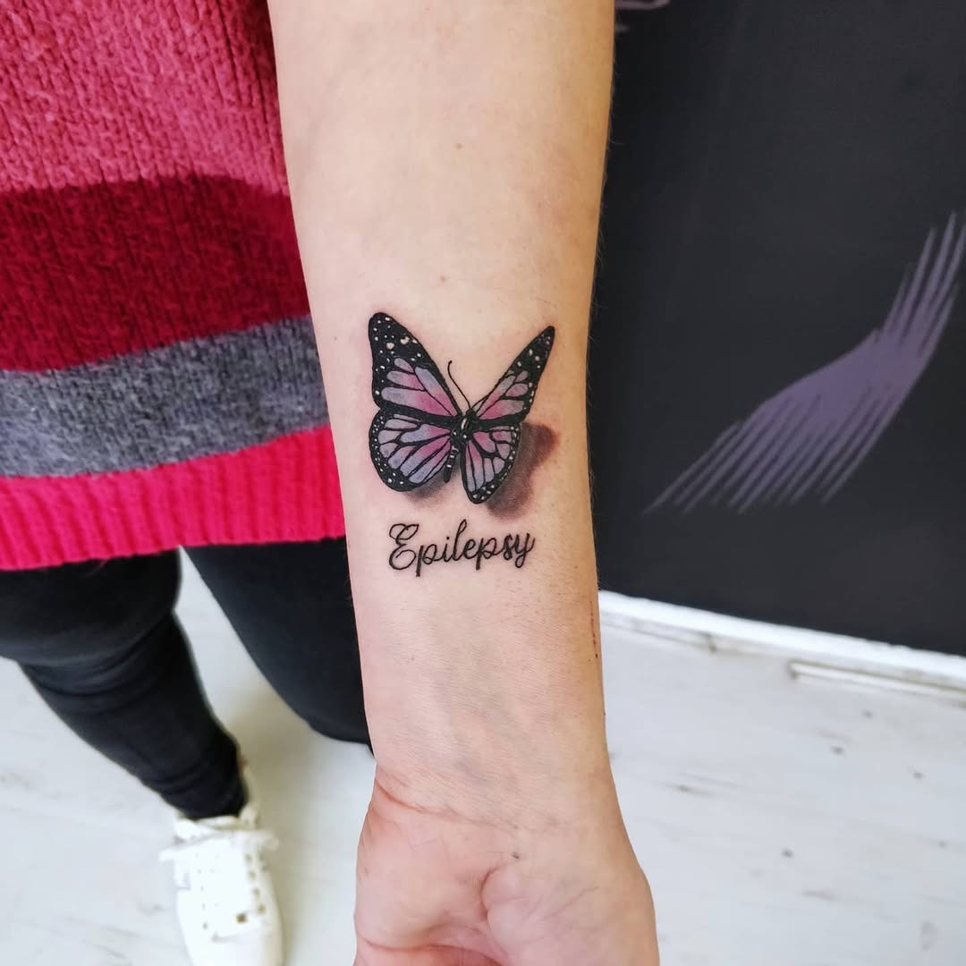 Beautiful butterfly tattoo with epilepsy awareness ribbon Tattoo Design
