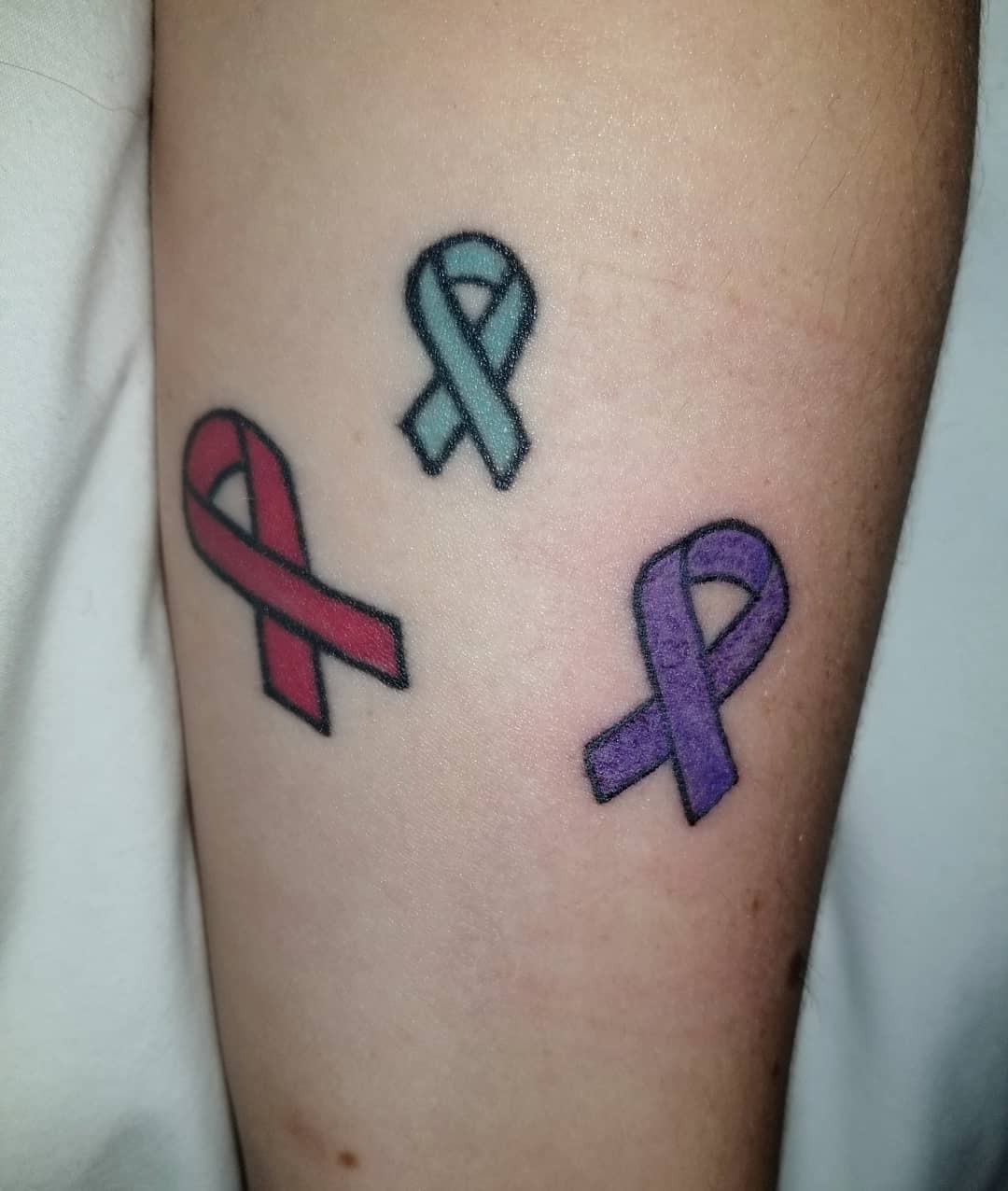 Colorful ribbons symbolize epilepsy awareness and support Tattoo Design