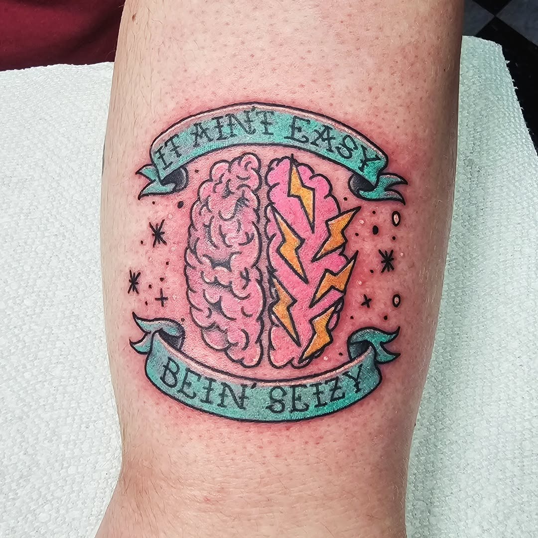 Vibrant Brain Tattoo with Lightning Strikes Tattoo Design