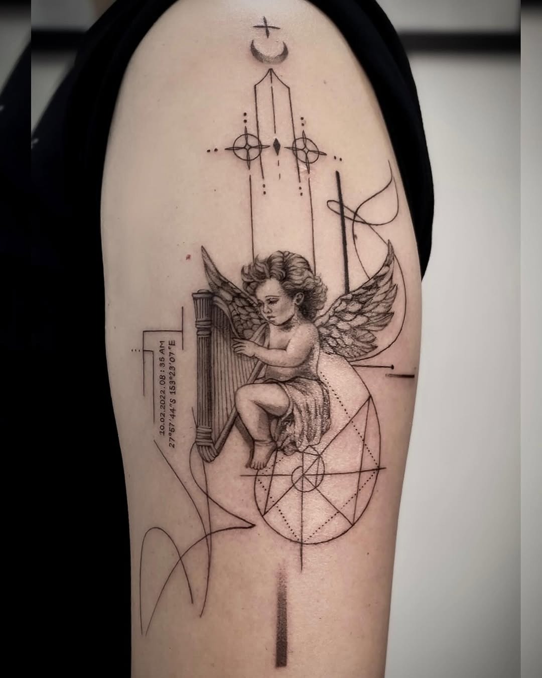 Graceful angel tattoo with geometric elements Tattoo Design