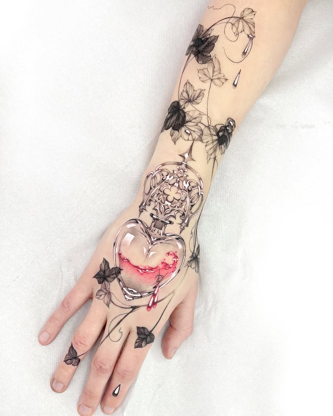 Intricate heart design entwined with ivy Tattoo Design
